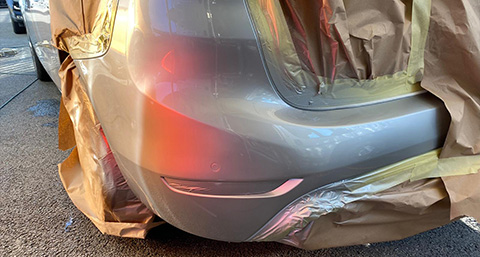 the repaired bumper of a silver car